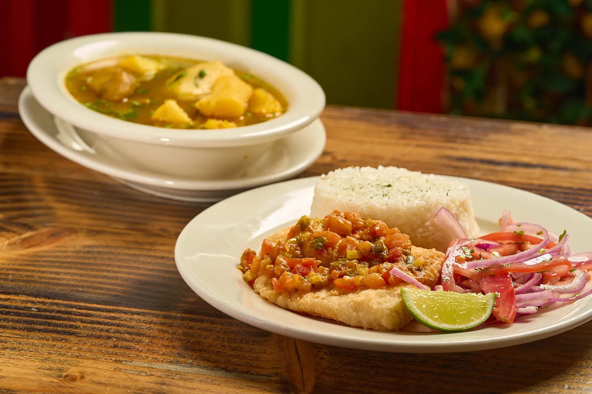 Sancocho de pescado with rice and fried fish